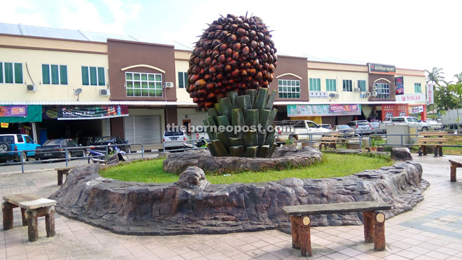 A replica of an oil palm fruit bunch — the landmark of Bekenu town. 