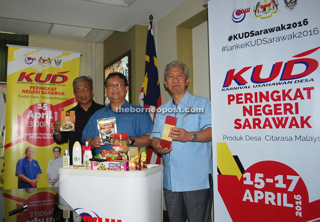 Alexander (centre) flanked by Yakup (left) and Chaiti showing some local products that will be showcased at the KUD carnival.