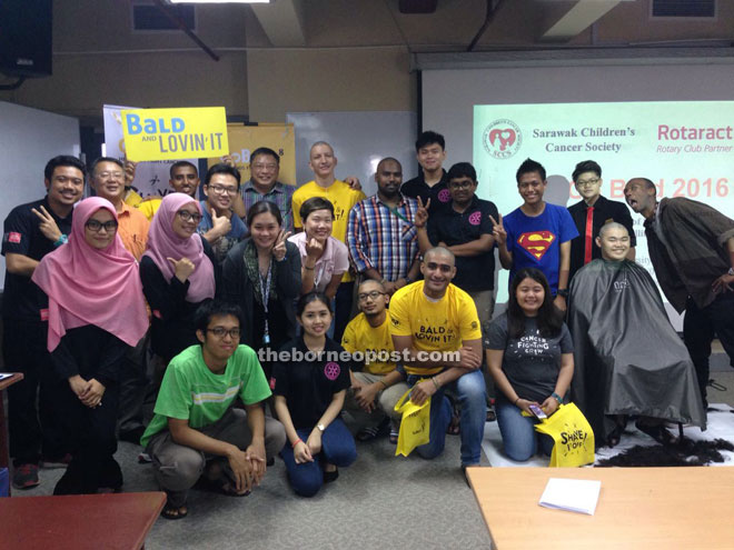 Swinburne Rotaract Club members are seen during a photo call for the satellite shave.