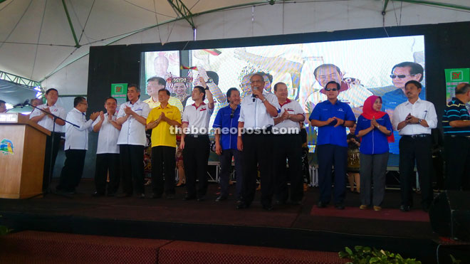 Adenan presenting one of his three sponsored songs, accompanied by other guests on the stage.