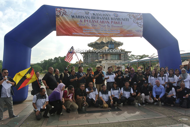 Nazri (back row, eighth left) with others at the launching of the new cycling product, the ‘Fort to Fort Trail’ at the Kuching Waterfront yesterday.