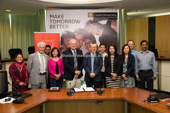 Representatives of Curtin Sarawak and AICB pose for a group photo.