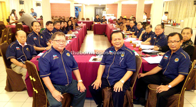 Clarence (middle) and John (front row, left) with members of the committee.