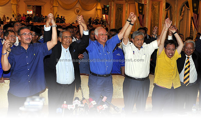 Najib (third left) and Adenan (second left) are joined by other BN leaders in celebrating the coalition’s victory in the 11th state election at the old State Legislative Assembly complex. From left are Defence Minister Datuk Seri Hishammuddin Tun Hussein, Ahmad Zahid, Dr Sim as well as Baleh assemblyman and PRS president Tan Sri Datuk Amar Dr James Masing. — Bernama photo