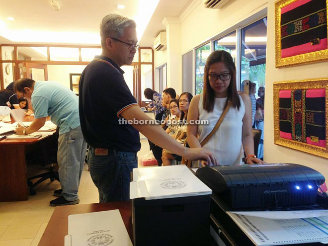 A registered Filipina voter casting her ballot at the voting centre in the Philippine Embassy recently.