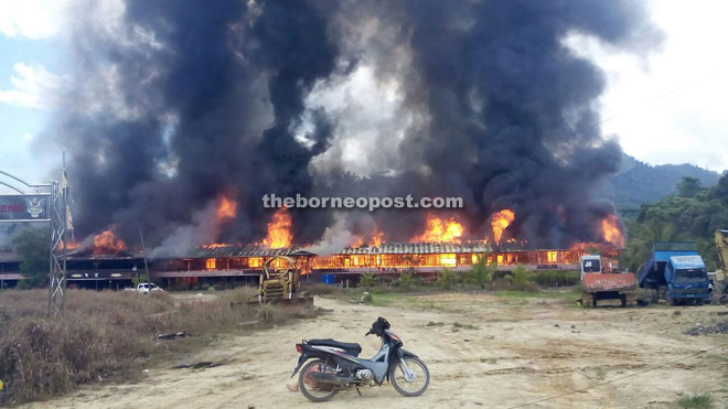 The fire razing Uma Badeng Asmidy Agau in Long Urun.