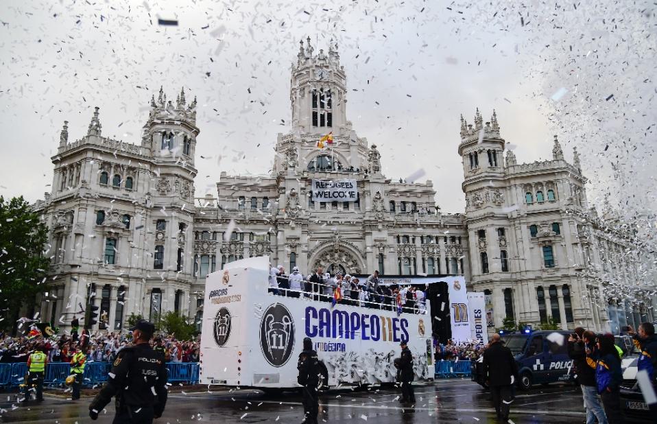 Real Madrid football players arrive to celebrate the team's win on Plaza Cibeles in Madrid on May 29, 2016. Photo by AFP