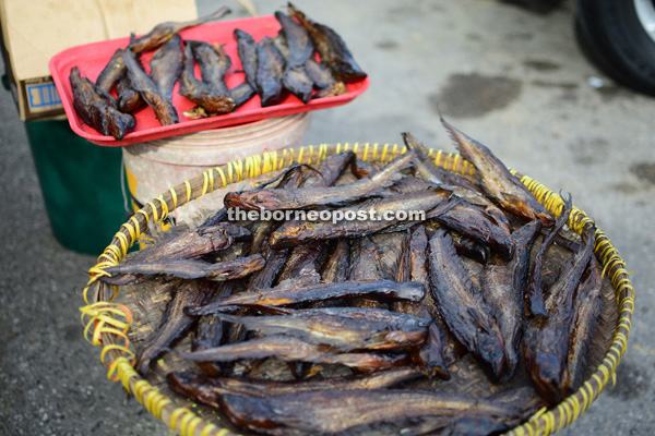 Some traders continue to dry the ‘ikan salai’ (smoked fish) before packing them.