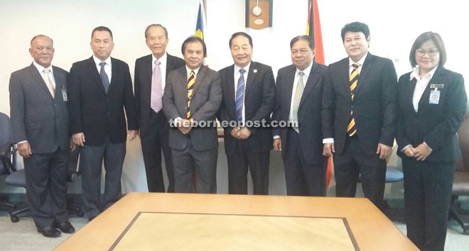 Wong (fifth left) with his former and current comrades in UPP during a photo-call. From left are Andrew, Pau, Tiong, Dr Jerip, Ranum, Rayong and Lee. — Photo by Churchill Edward