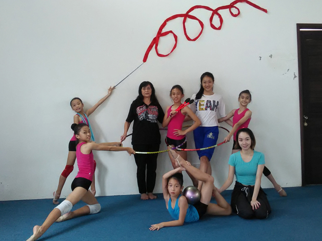 Sarawak are fielding five gymnasts for Sukma XVIII. They are pictured with Helena (second left, standing), Shaleen (squatting) and Fiona (second right, standing) during a training session at the training centre at Queen’s Court. 