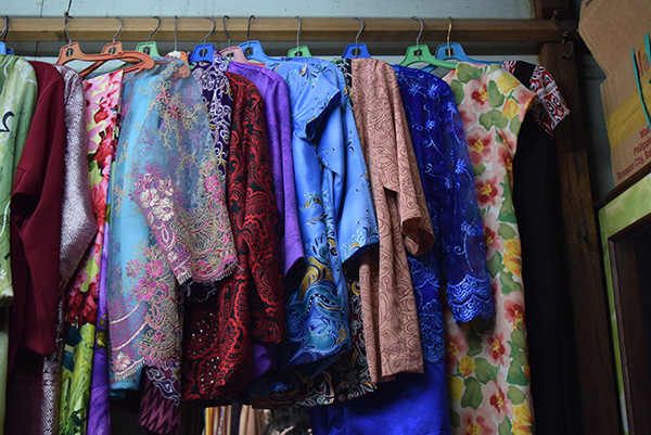 Pieces of Baju Kurung ready for collection at a small Chinese tailoring shop in Miri.