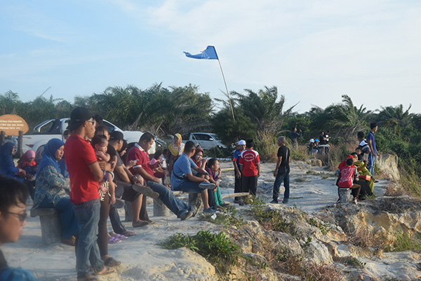 Visitors enjoy the sights and sounds of the area.