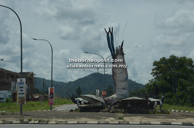 Sculptor of a praying prawn at one of the roundabouts in Beautort town. 