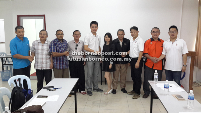 Alan Ling (fifth left) and Dr Ting (third right) with the PH Community councillors and an unidentified person.