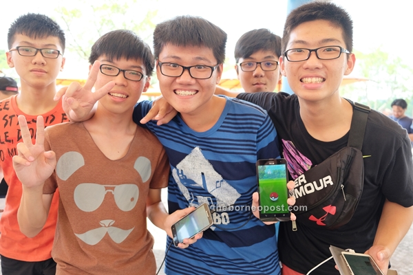 (From left) Secondary school students Pui Shiu Nyee, Lim Aik Sen, Lim Chun Yin, Isaac Khiung and Ho Wen Chun proudly display their Pokemon.