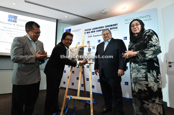 (From second left) Johari, Mohammad Faiz and MIA vice president Datuk Zaiton Mohd Hassan at the official launching ceremony of the MIA new corporate office in Bangsar South City.