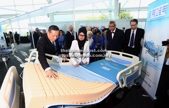 Fatimah at an exhibition booth, accompanied by the Ministry of Health’s deputy director-general Datuk Dr Lokman Hakim Sulaiman. — Muhammad Rais Sanusi