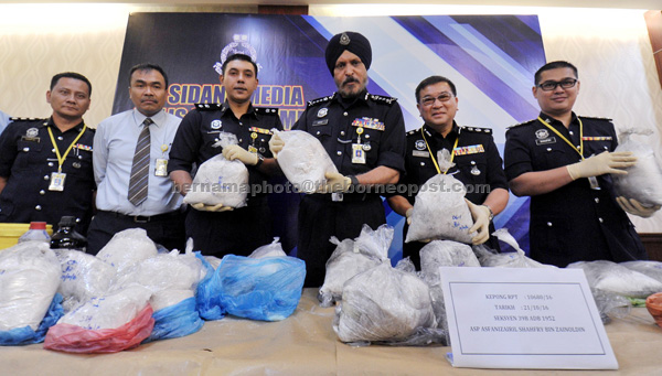Amar Singh (fourth left) showing Ketamine worth RM7.07 million that were seized during a press conference at Kuala Lumpur police headquarters. — Bernama photo
