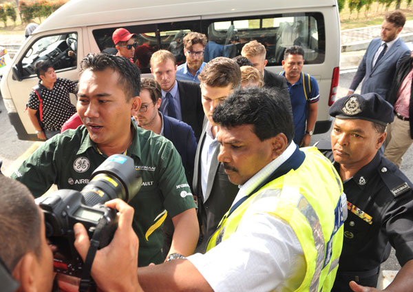 The nine Australian men on their way to Sepang Sessions Court. — Bernama photo