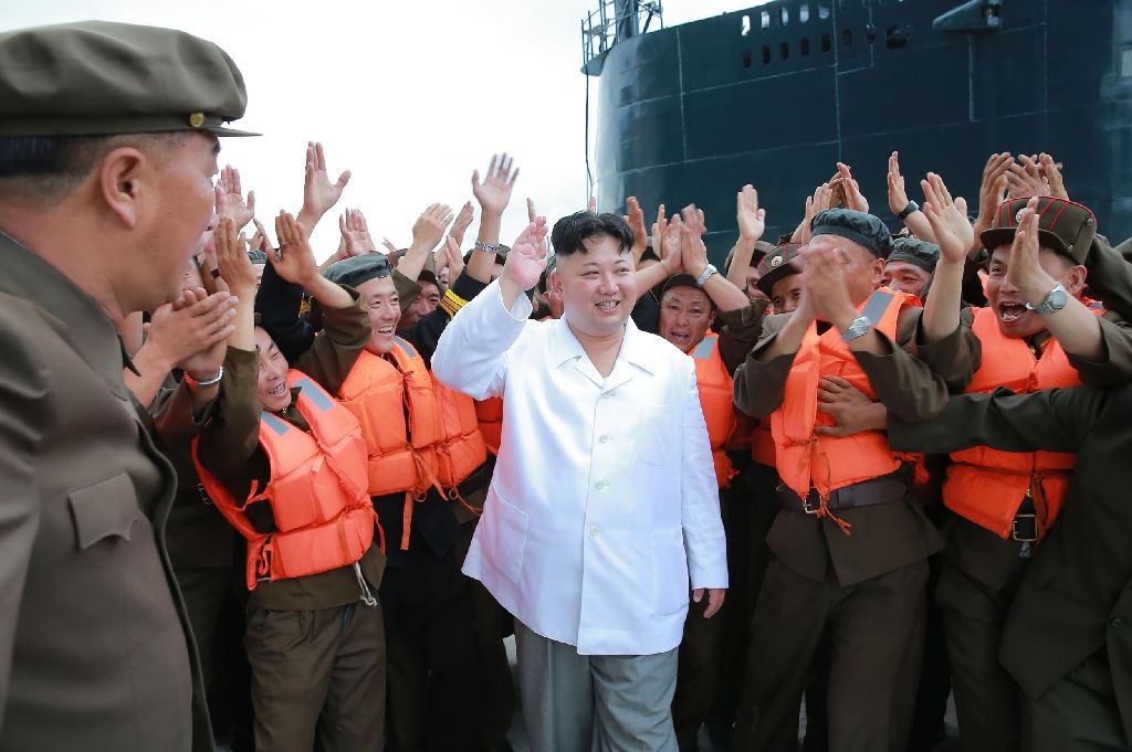 View photos North Korean leader Kim Jong-Un (C) arrives to inspect a test-fire of strategic submarine-launched ballistic missile at an undisclosed location, on Aug 25, 2016. AFP Photo