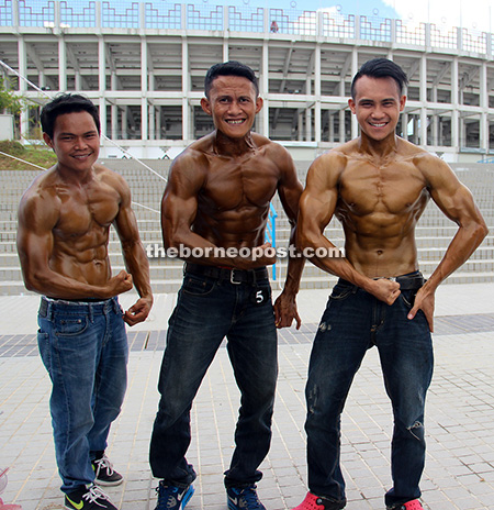 Contestants get ready for Mr Fit Belia fitness competition, one of the activities held during the state-level Youth Day 2016 in Kuching. — Photos by Muhamad Ghaz Ghazali