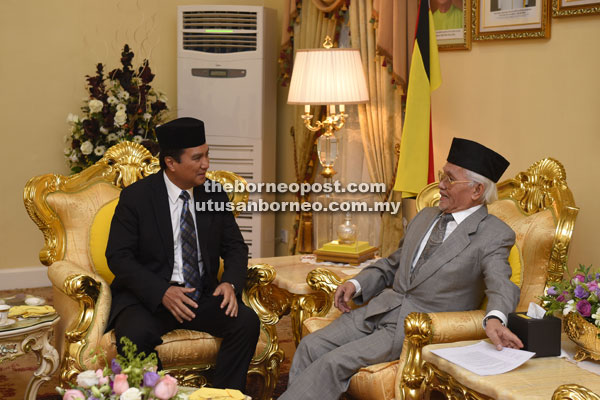 Taib (right) has a discussion with Sharbini during the courtesy call.