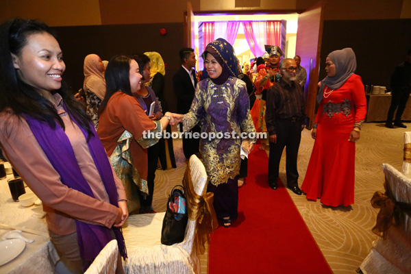 Fatimah is greeted by guests upon her arrival at the appreciation dinner.