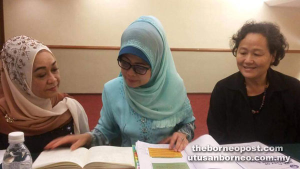 Fatimah (centre) looking through the notes after chairing the MPPS meeting yesterday. Also seen is MPPS member Serina Sauni (left) and Ministry of Welfare, Women and Community Wellbeing permanent secretary Datin Megir Gumbek. 