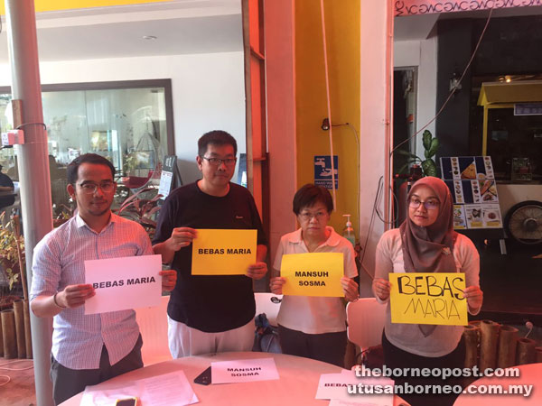 Teo (second left) and (from right) Saifulnizam, Tang and Murnie holding placards calling for the release of Chin.