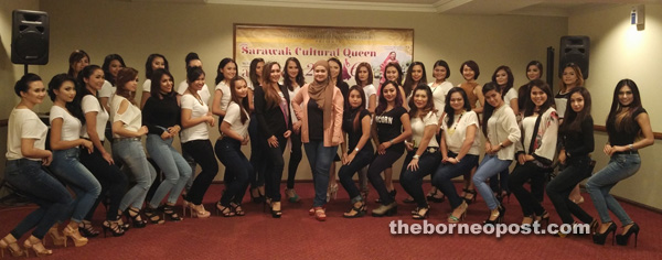 Sharifah (standing centre) flanked by winner of Sarawak Beauty Queen 1/2014 Cammielye Oliver Rega on her right in a group photo with the semi-finalists.