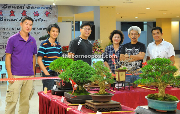 Jong (second right) is seen with other bonsai enthusiasts at the 12th Sarawak Bonsai and Stone Show.