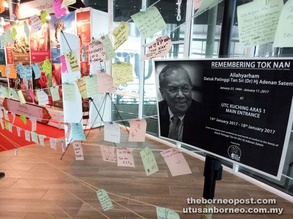 Condolence messages and words of comfort written on sticky notes are displayed in an area provided by Azam Youth Central for the general public at UTC Kuching.