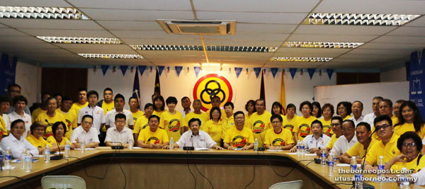 Chieng (seated centre) with others before a press conference.