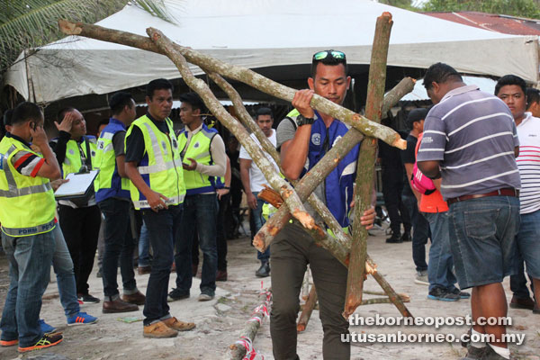 The police dismantle the boom gate.