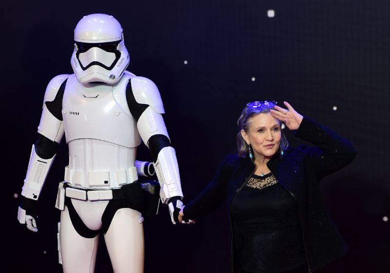 US actress Carrie Fisher poses with a Storm Trooper as she attends the European premiere of "Star Wars: The Force Awakens" in December 2016. AFP Photo