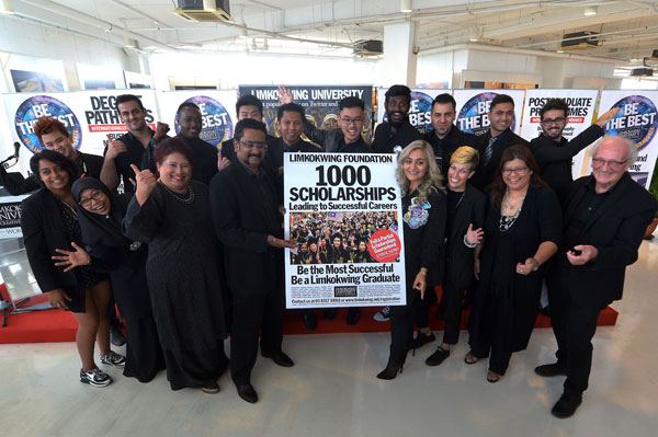 Fajura (front row, third left) and Limkokwing University special assistant to the president Dr Mahaaganapathy (front row, fourth left) with the lecturers and ex-students who received their scholarships at a press conference in Cyberjaya. — Bernama photo