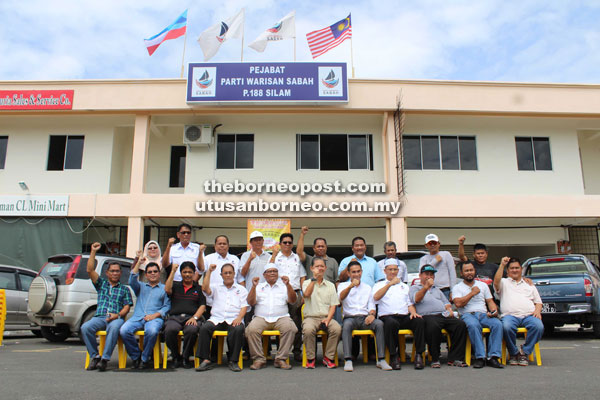  Mohamaddin (seated sixth from right) with other members of Warisan.