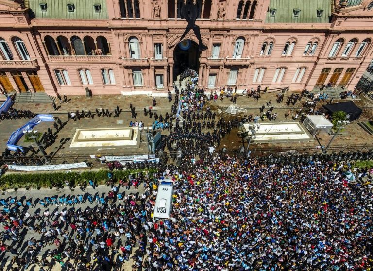Maradona honoured by thousands in native Argentina amid clashes